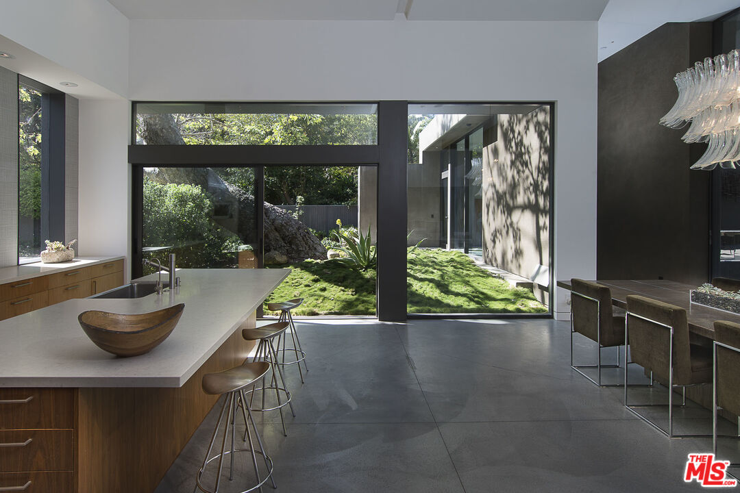 671 Latimer Road Santa Monica, CA 90402 - Photo 11 of 27 a kitchen with a table and chairs