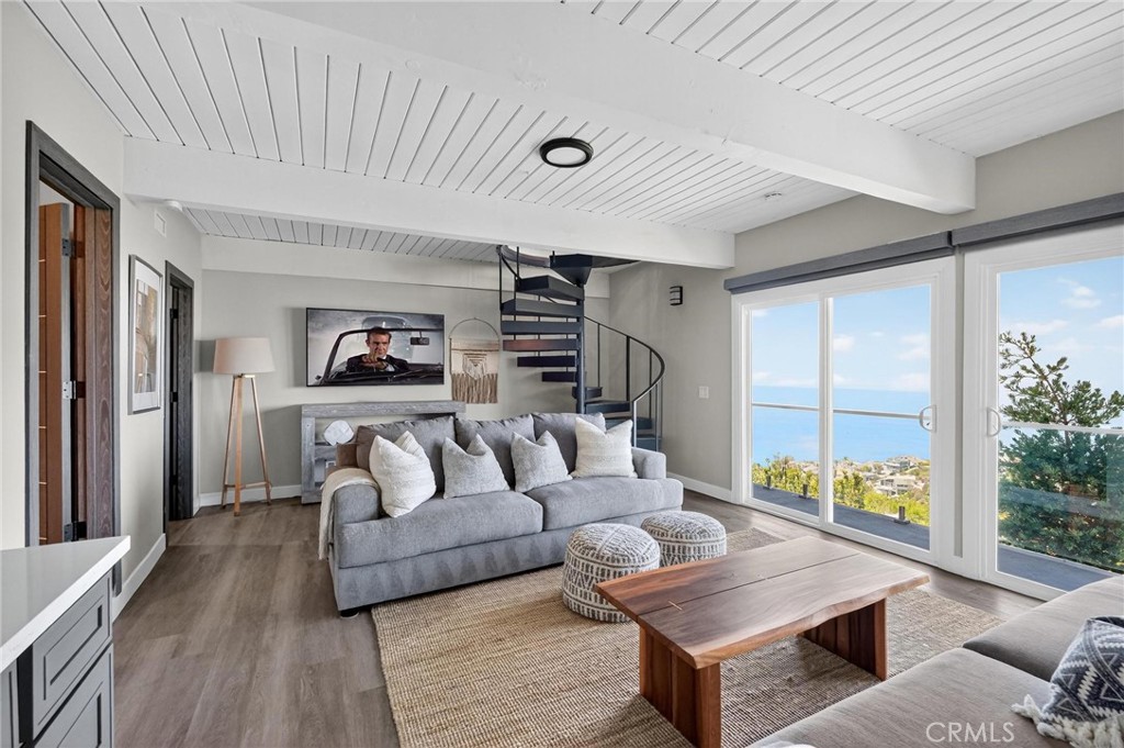 865 Quivera Street Laguna Beach, CA 92651 - Photo 12 of 23 a living room with furniture and a large window