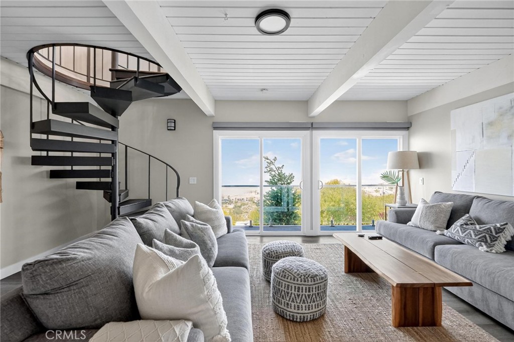 865 Quivera Street Laguna Beach, CA 92651 - Photo 13 of 23 a living room with furniture and a large window