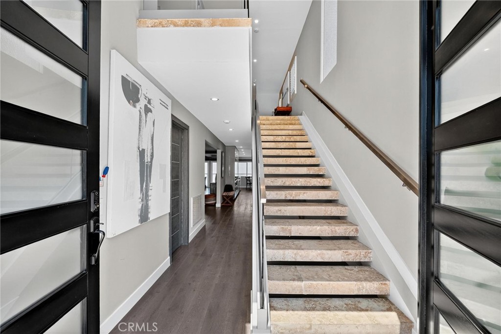 865 Quivera Street Laguna Beach, CA 92651 - Photo 3 of 23 a view of staircase with wooden floor and white walls