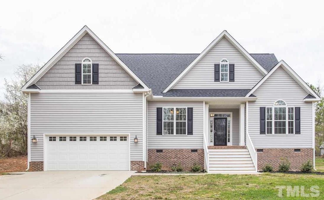 3318 High Gate Road Raleigh, NC 27603 - Photo 1 of 16 a view of a large white house with a large windows