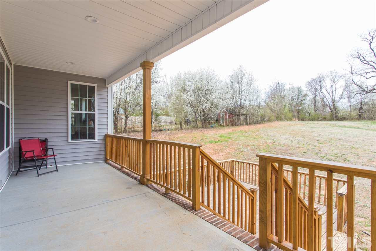 3318 High Gate Road Raleigh, NC 27603 - Photo 16 of 16 a view of a patio with a yard