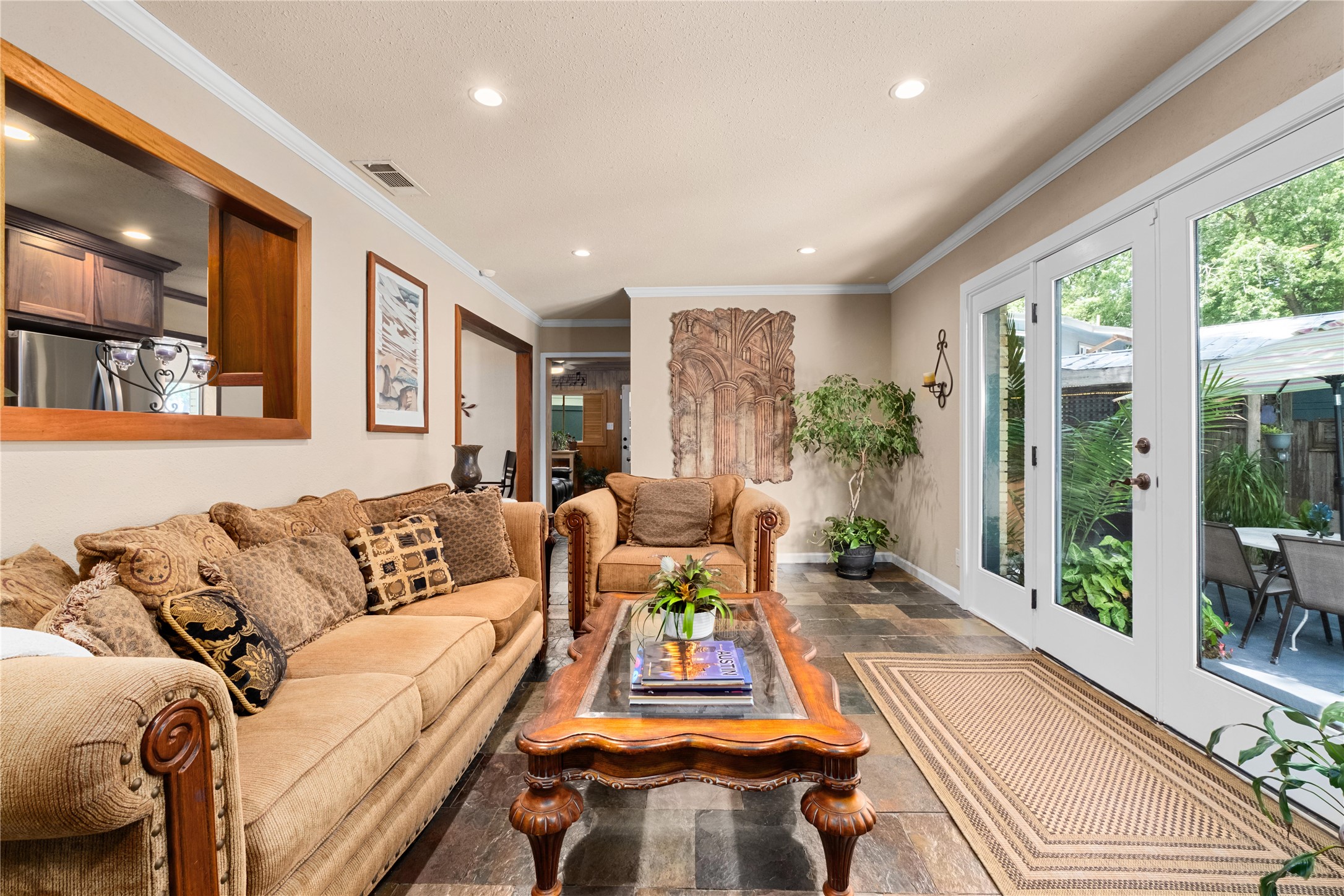 2301 Del Curto Road Austin, TX 78704 - Photo 12 of 33 a living room with furniture and a large window