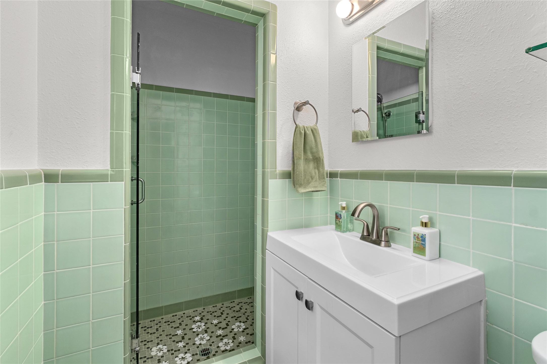 2301 Del Curto Road Austin, TX 78704 - Photo 16 of 33 a bathroom with a sink and a mirror