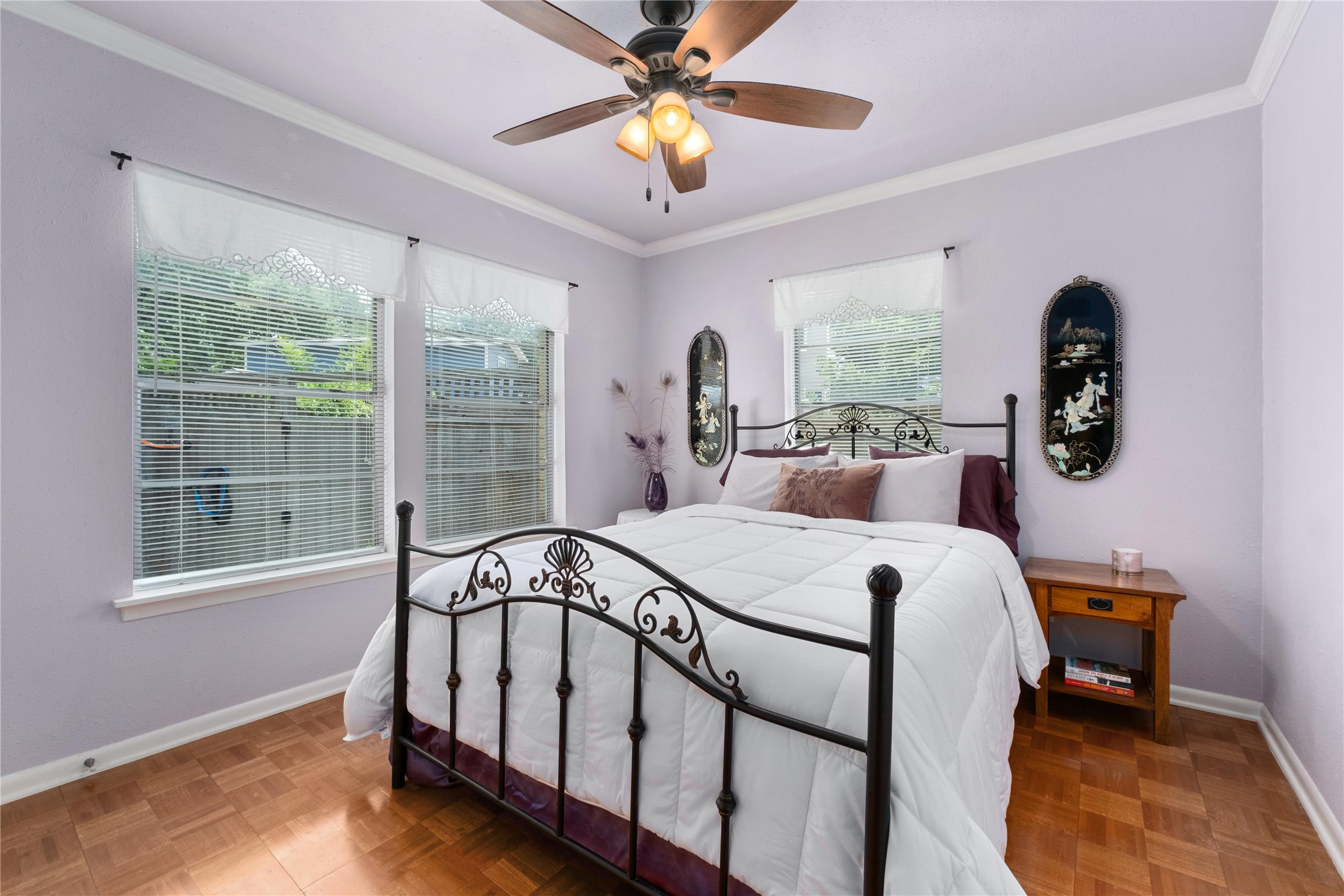 2301 Del Curto Road Austin, TX 78704 - Photo 18 of 33 a bed sitting in a bedroom next to a window