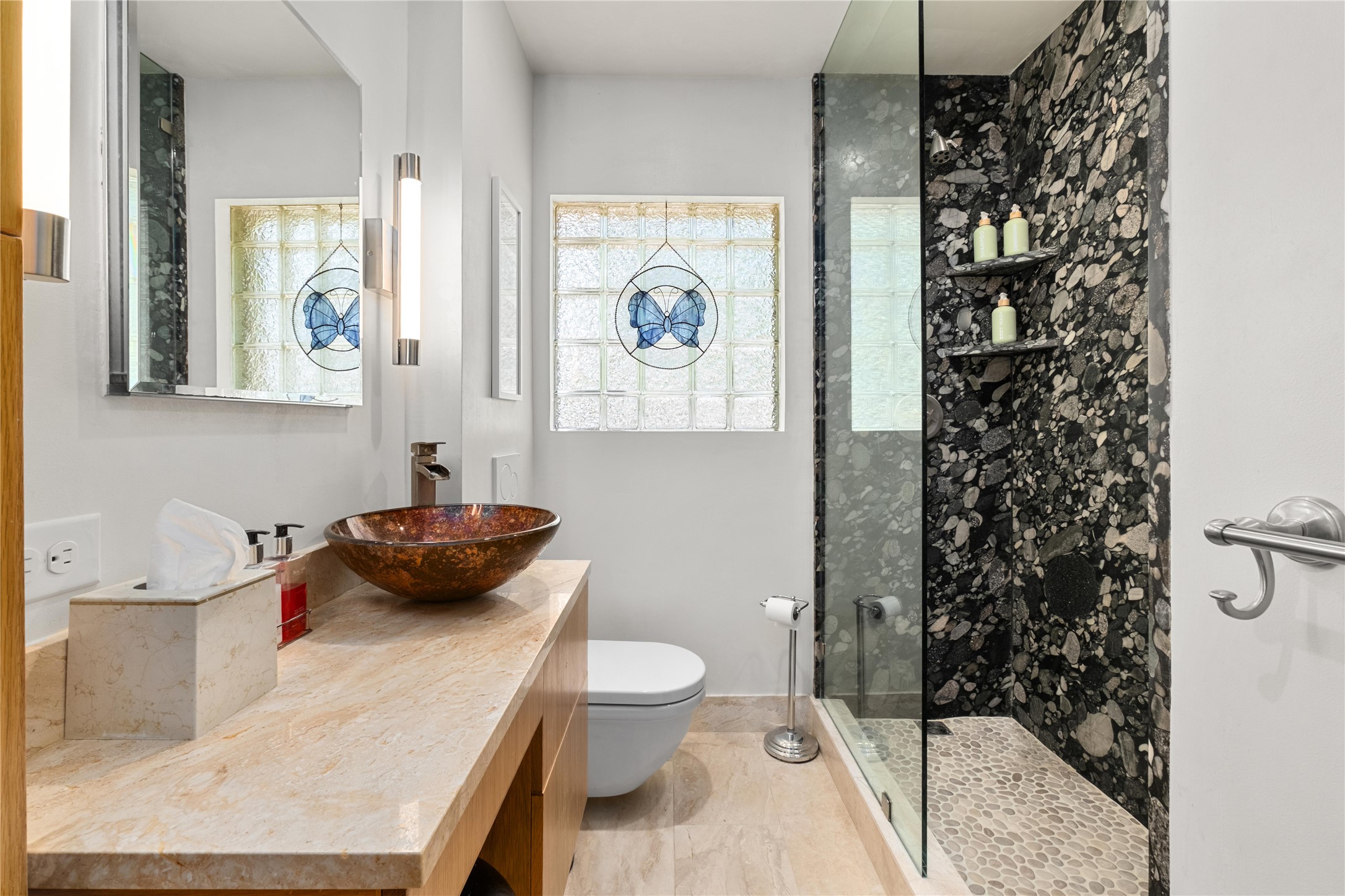 2301 Del Curto Road Austin, TX 78704 - Photo 19 of 33 a bathroom with a sink a toilet and shower