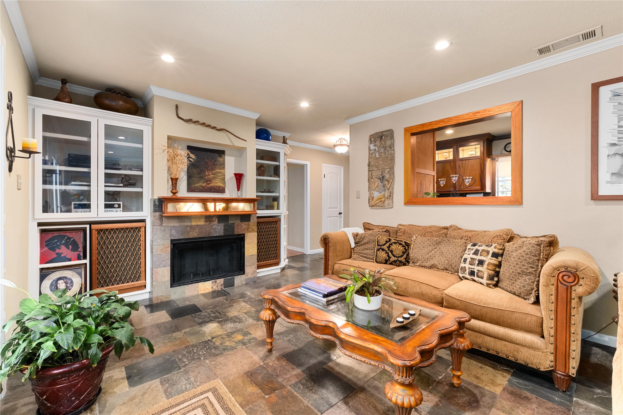 2301 Del Curto Road Austin, TX 78704 - Photo 10 of 33 a living room with furniture a fireplace and a kitchen view