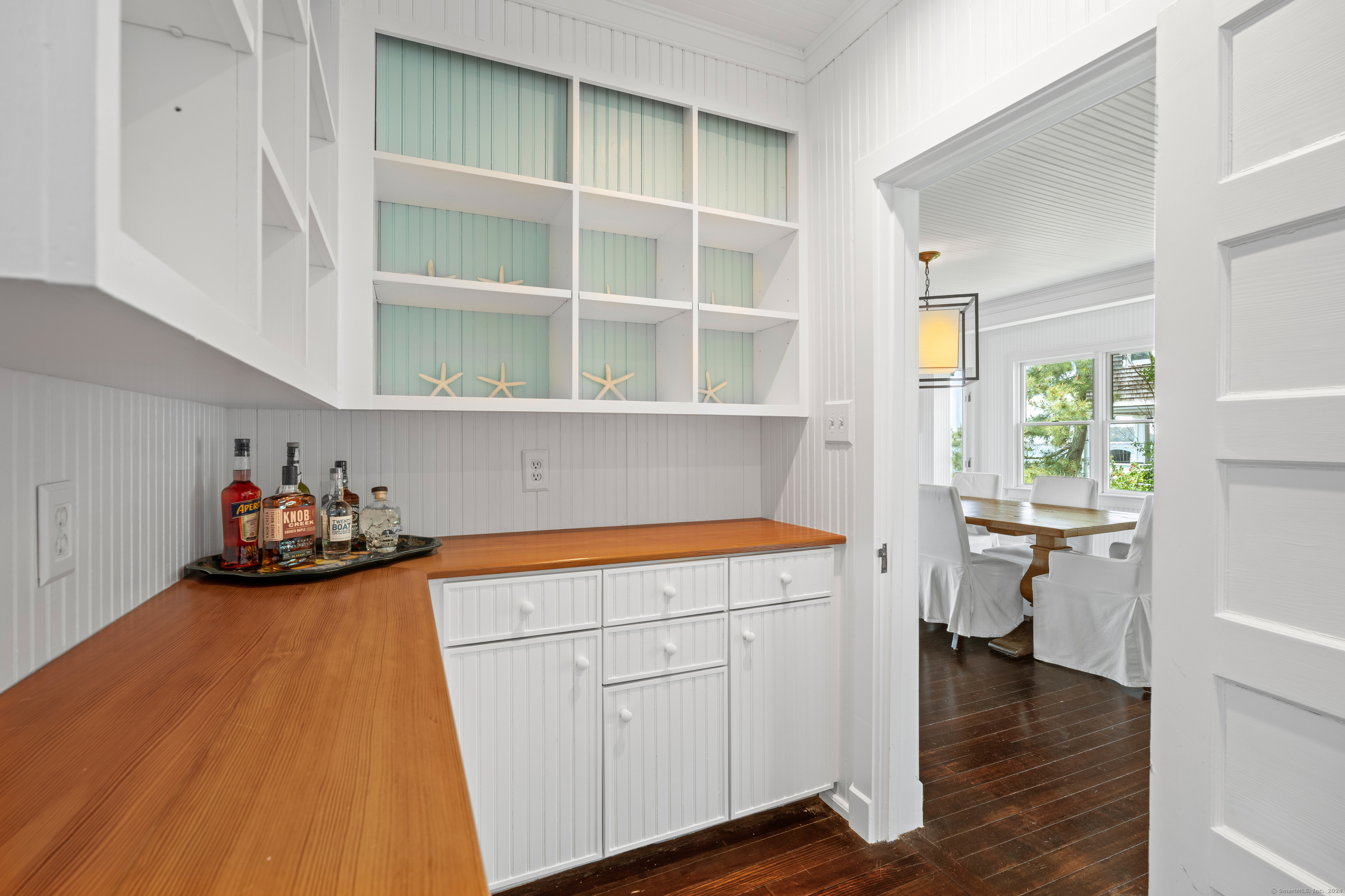 118 Middle Beach Road Madison, CT 06443 - Photo 16 of 28 a kitchen with a cabinets and wooden floor