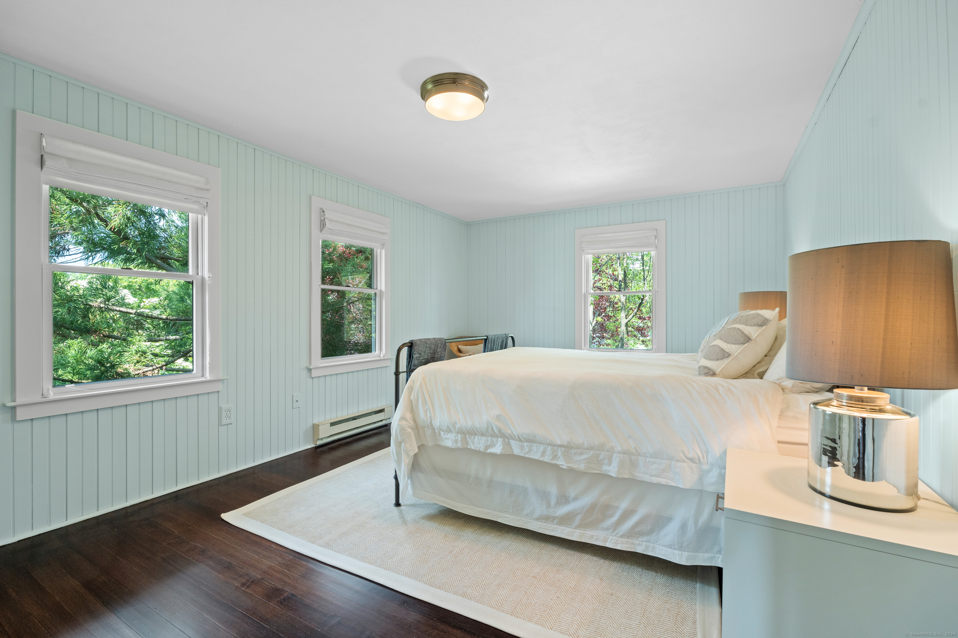 118 Middle Beach Road Madison, CT 06443 - Photo 19 of 28 a bed sitting in a bedroom next to a window