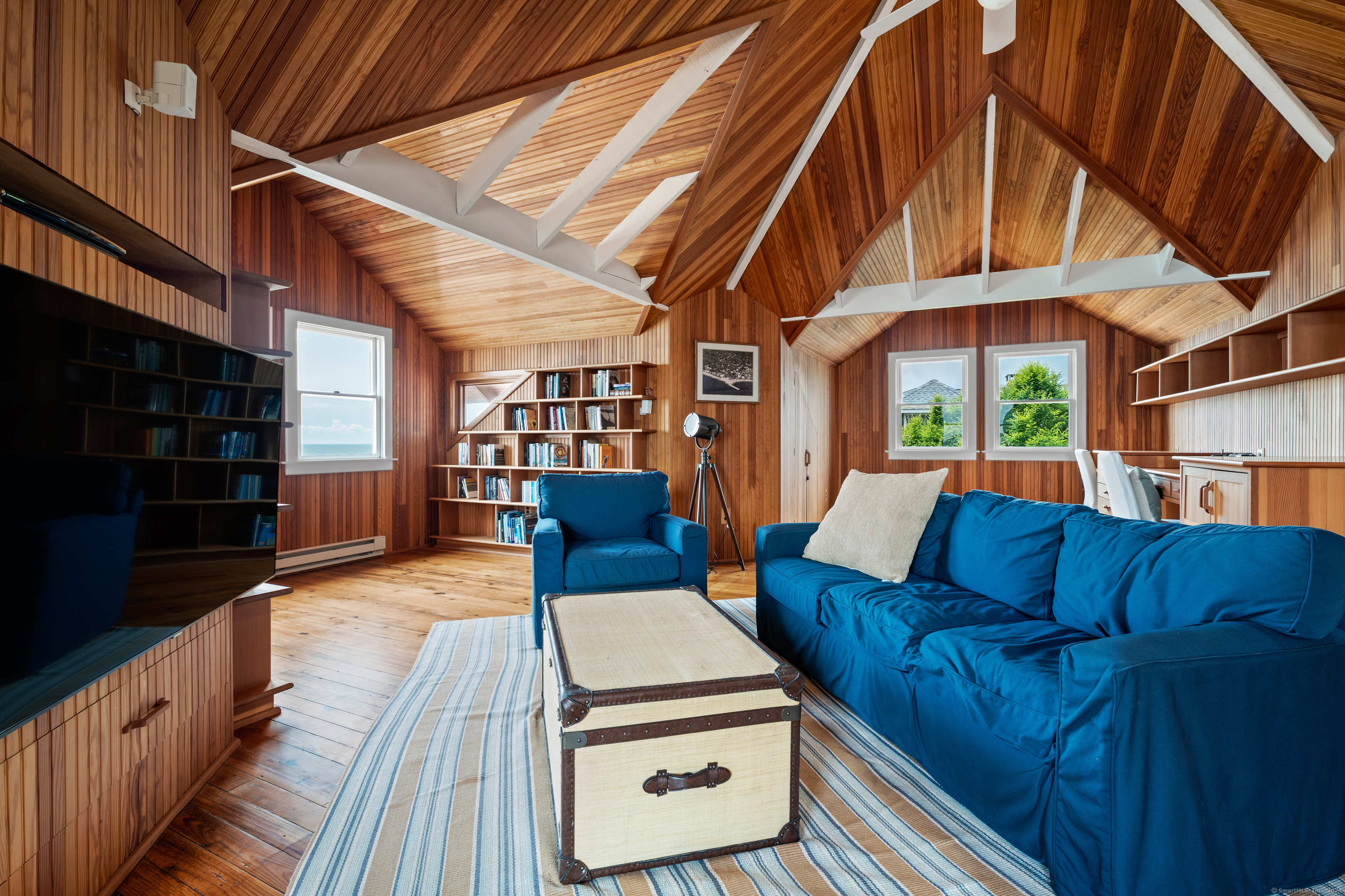 118 Middle Beach Road Madison, CT 06443 - Photo 23 of 28 a living room with furniture a ceiling fan and a rug