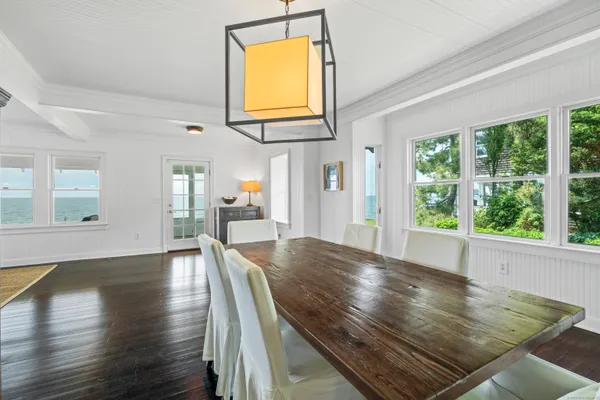a view of kitchen dining table and wooden floor