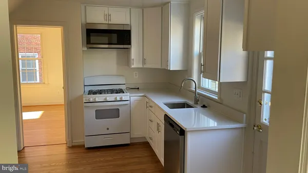 a kitchen with a stove and a microwave