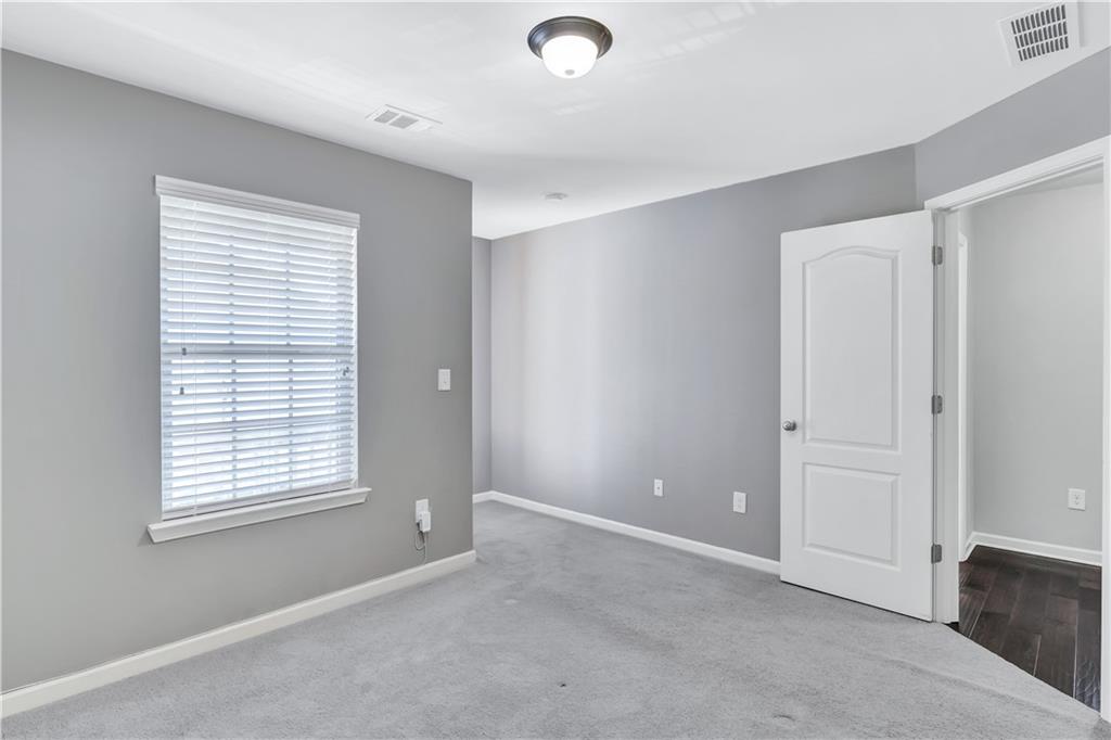 330 Avalon Square Fairburn, GA 30213 - Photo 34 of 52 a view of an empty room with a window