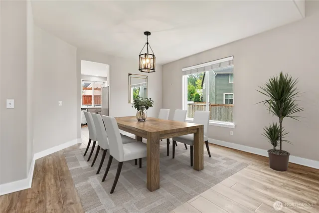 a living room with furniture a fireplace and a table