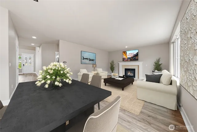 a view of a dining room with furniture and wooden floor
