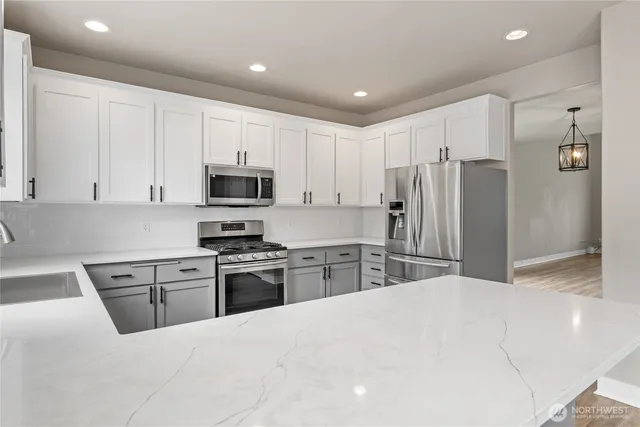 a kitchen with sink cabinets and wooden floor
