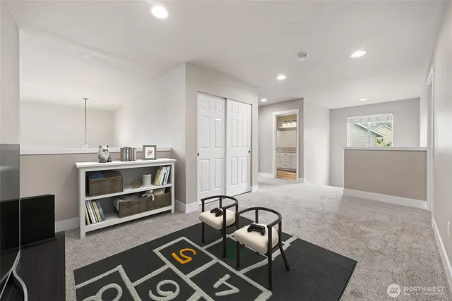 a spacious bedroom with a bed and couch