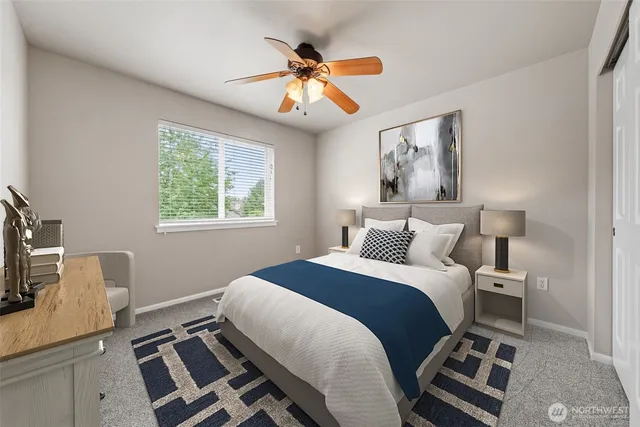 a bedroom with a bed and a couch