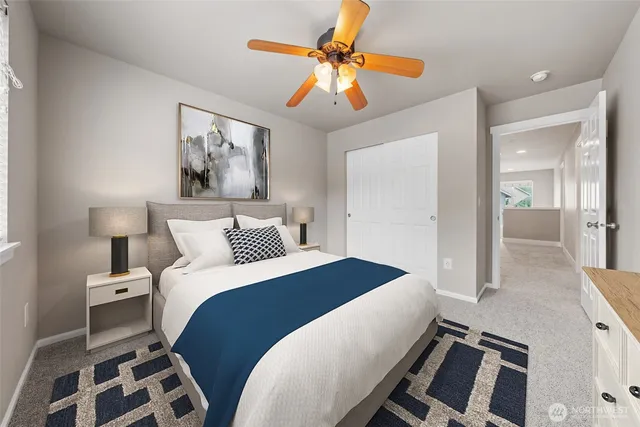 a bedroom with a bed and flat screen tv