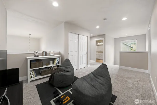 a view of a swimming pool with a yard and mountain view in back