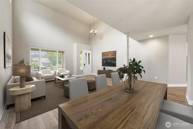 a living room with furniture potted plant and windows