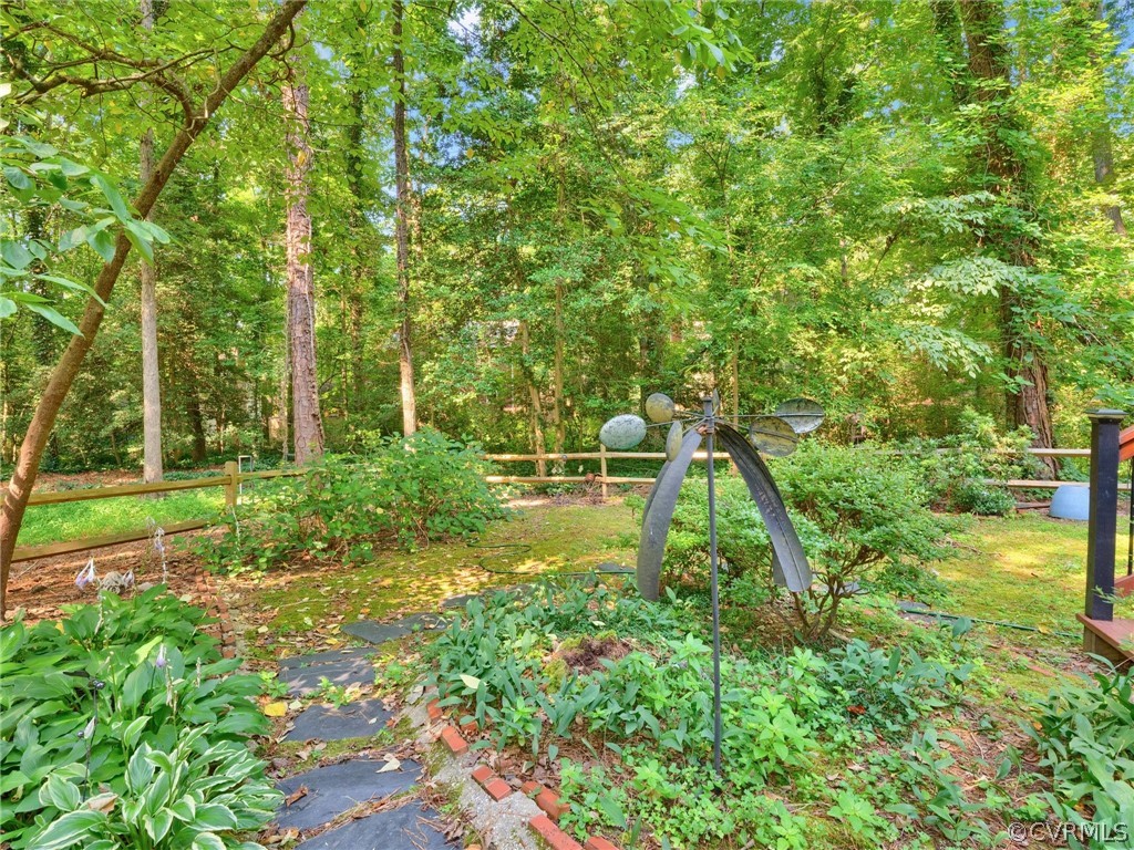 13618 Hunts Bridge Road Midlothian, VA 23112 - Photo 7 of 42 a view of a yard with a house in the background