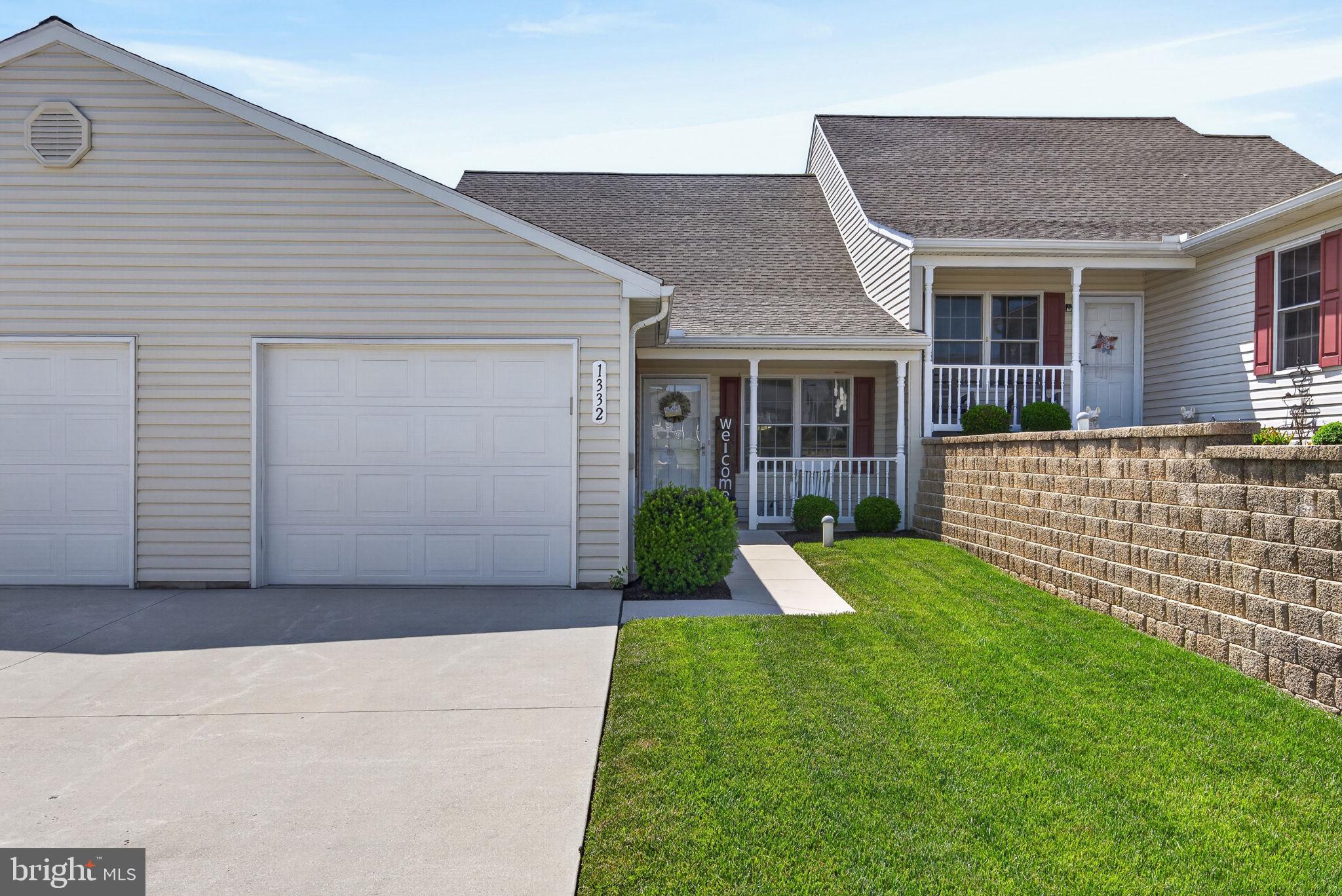 1332 Pleasant View Drive, Unit 75 Spring Grove, PA 17362 - Photo 1 of 26 a view of a house with a yard and porch