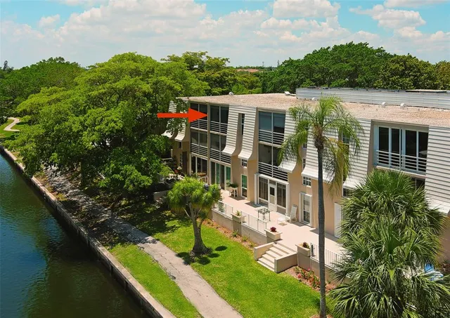 an aerial view of house with yard swimming pool and outdoor seating