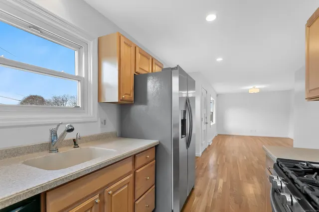 a kitchen with a sink and a refrigerator