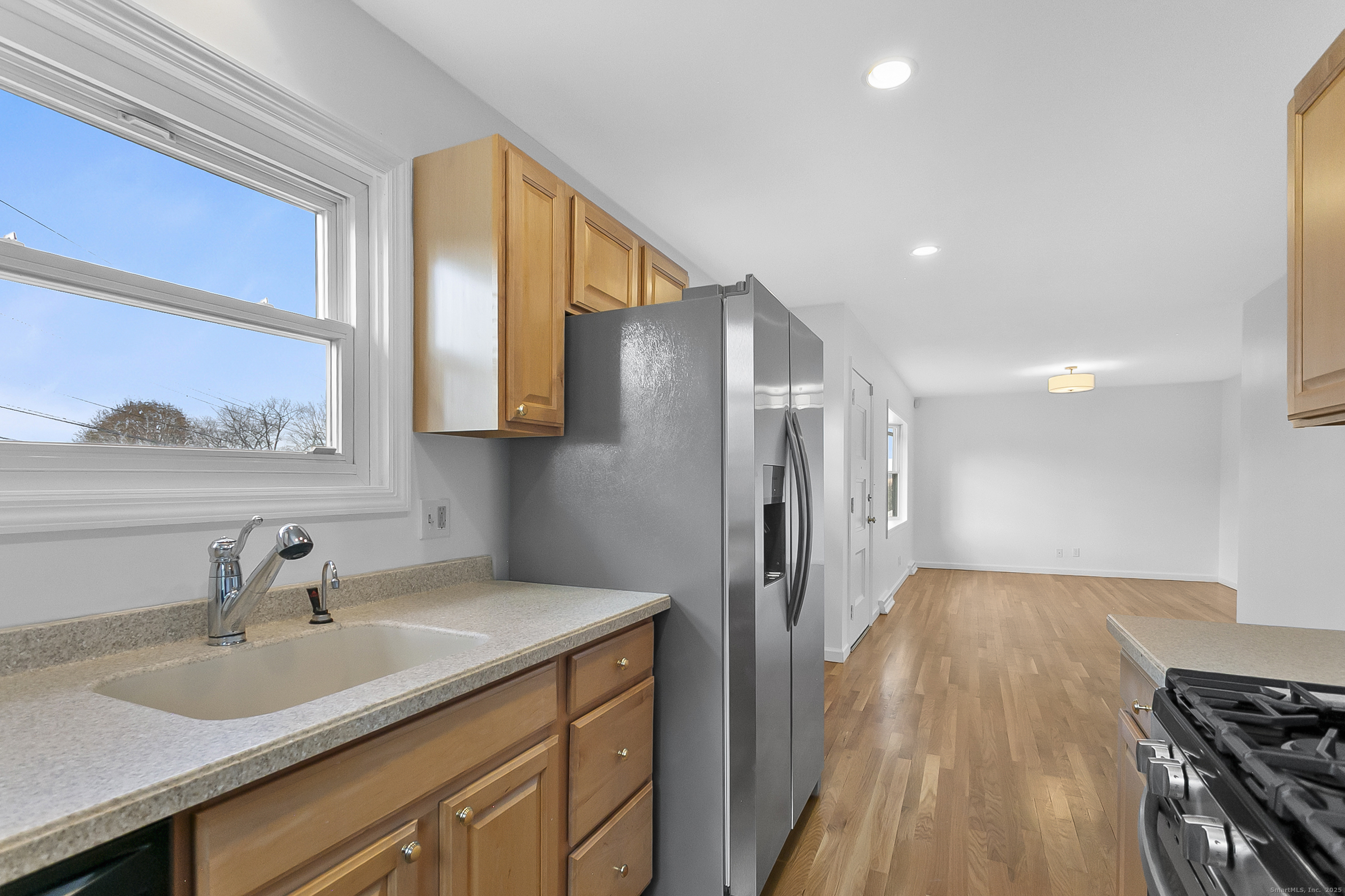 23 Berkshire Road Ansonia, CT 06401 - Photo 13 of 23 a kitchen with a sink and a refrigerator
