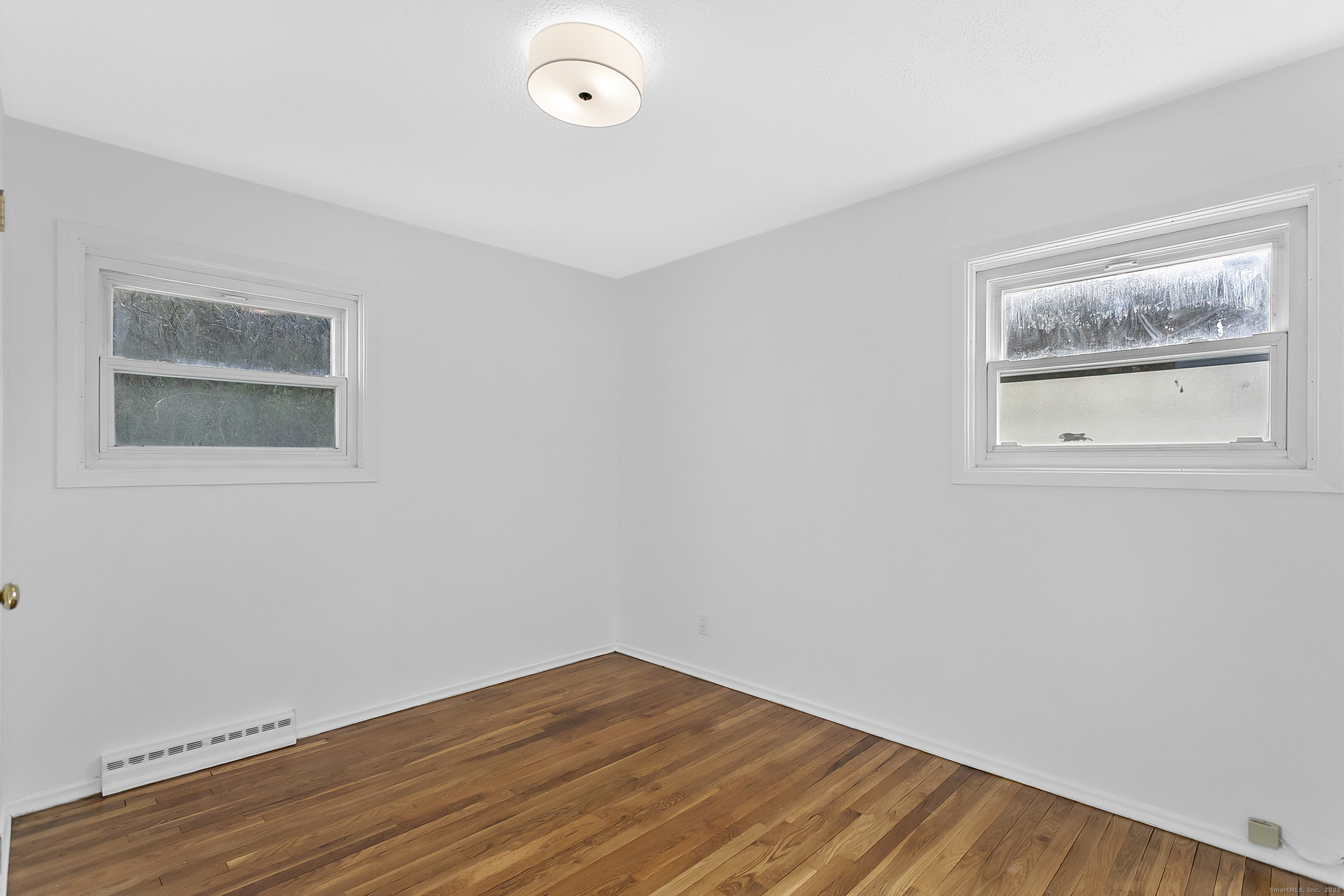 23 Berkshire Road Ansonia, CT 06401 - Photo 16 of 23 a view of empty room with wooden floor