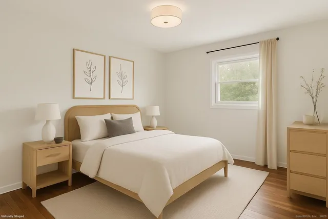 a bedroom with a bed and a view of bathroom