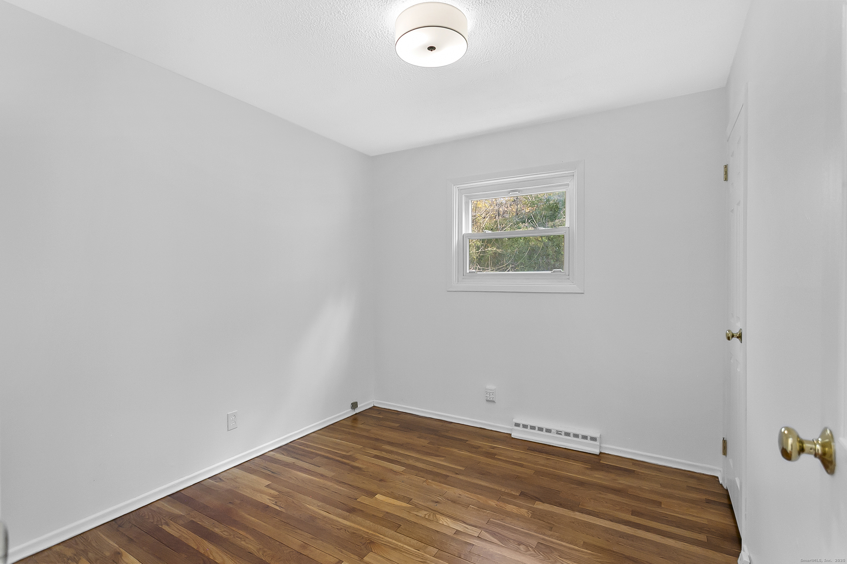 23 Berkshire Road Ansonia, CT 06401 - Photo 18 of 23 a view of room with hardwood floor and window