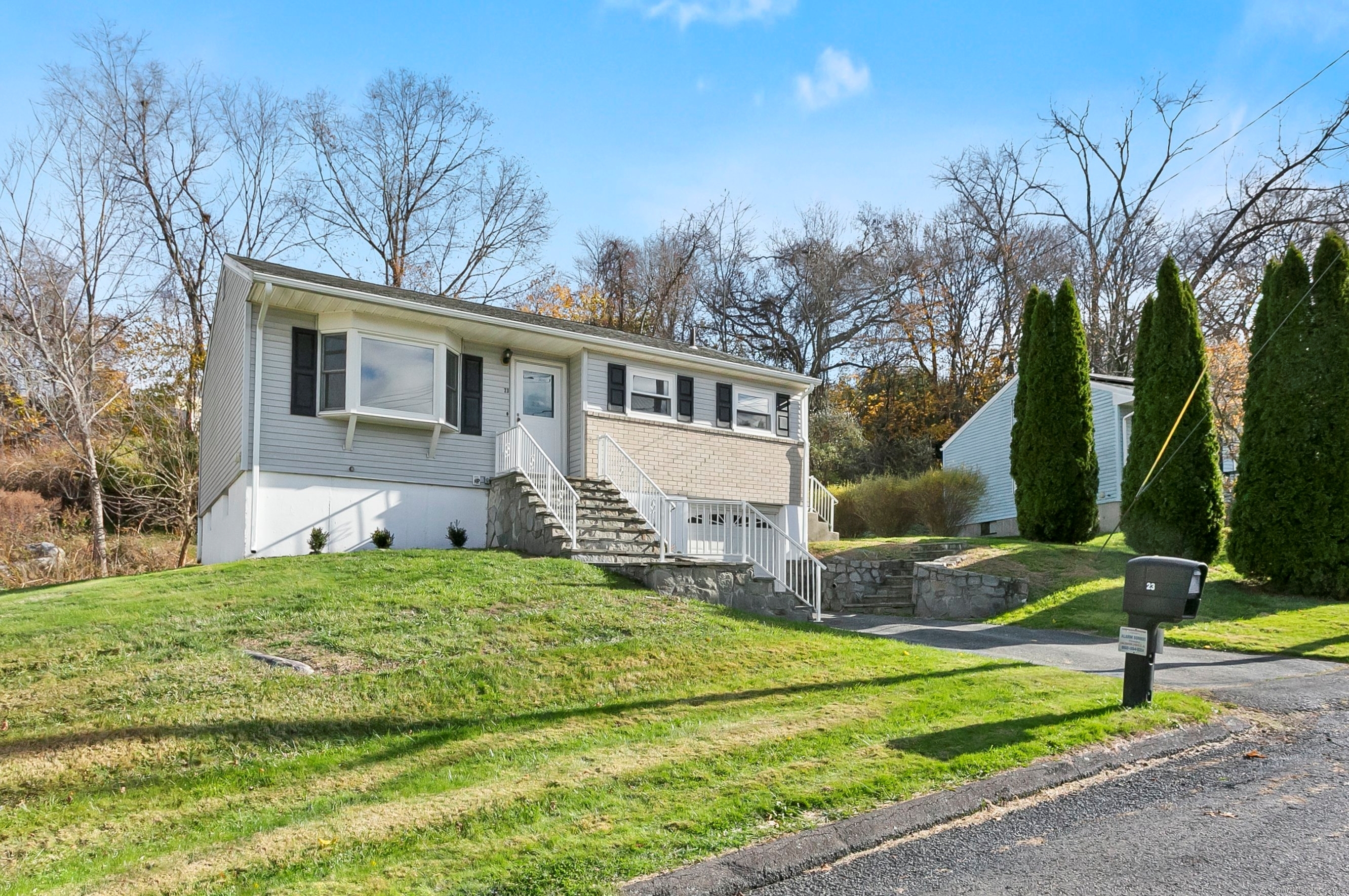 23 Berkshire Road Ansonia, CT 06401 - Photo 21 of 23 a house that has a tree in front of it