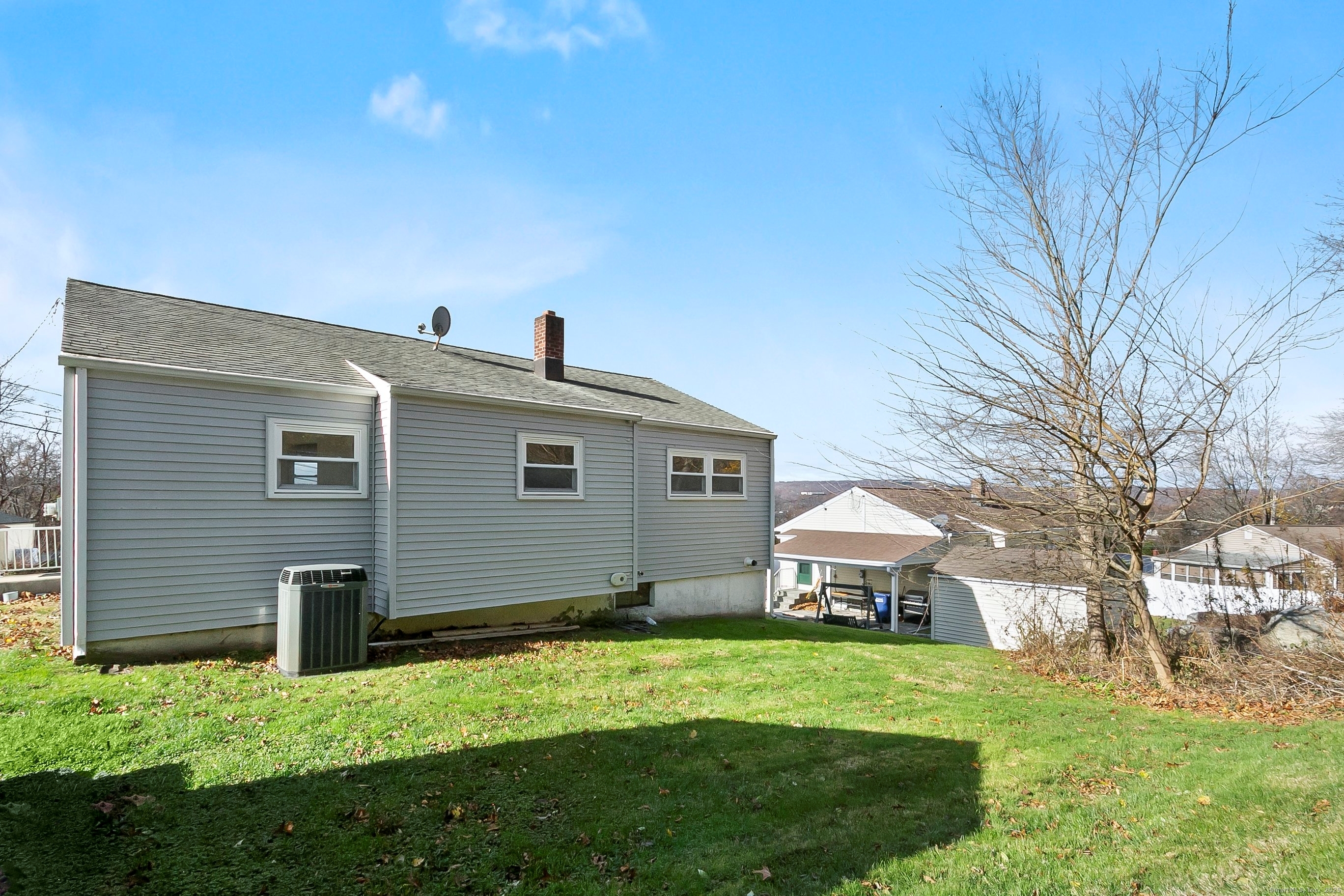 23 Berkshire Road Ansonia, CT 06401 - Photo 22 of 23 a front view of a house with a yard