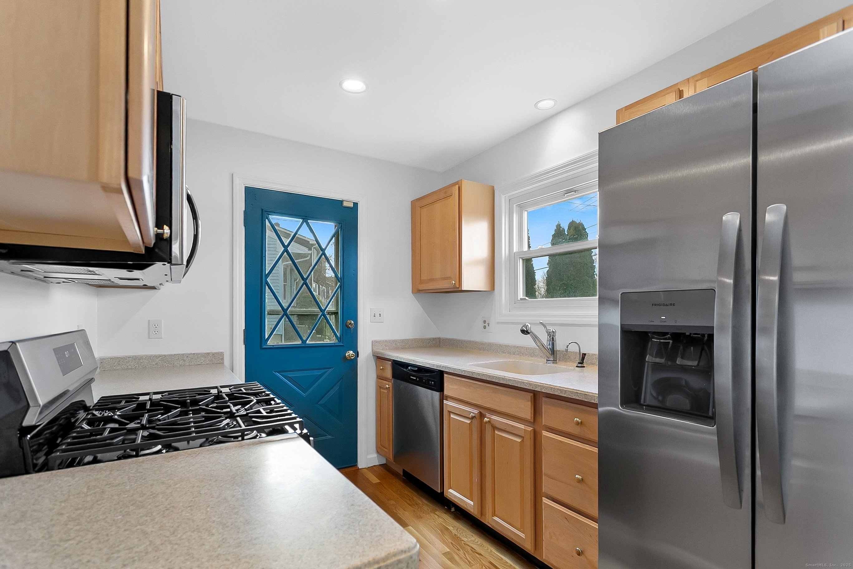 23 Berkshire Road Ansonia, CT 06401 - Photo 10 of 23 a kitchen with a sink stove and refrigerator