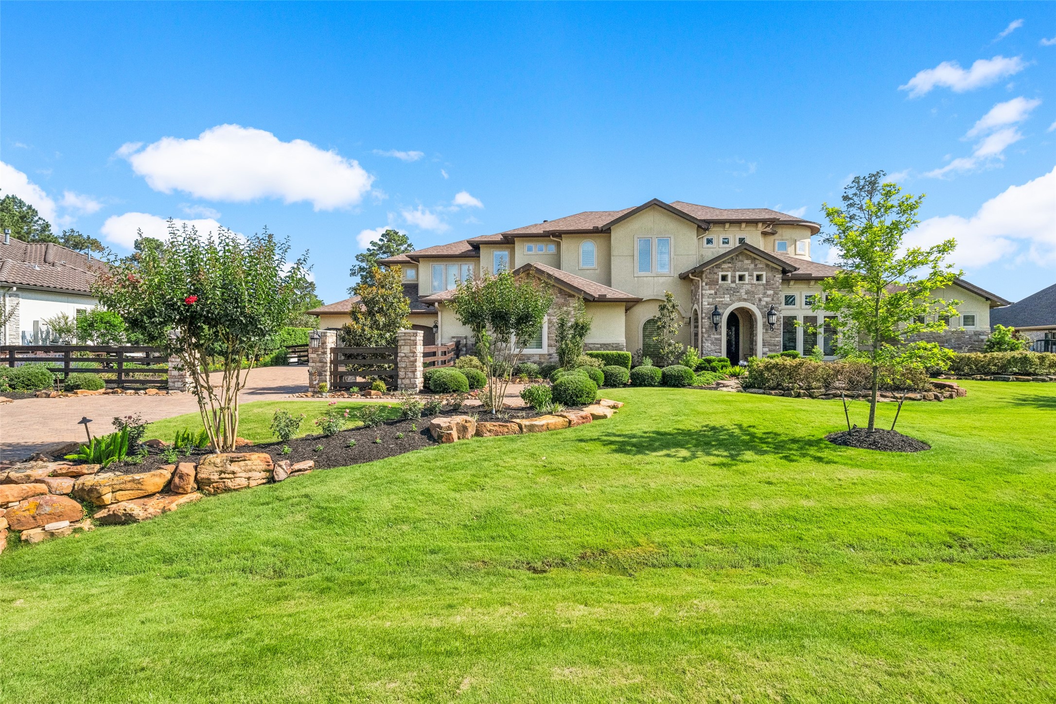 Lush landscaping, eaves LED lighting, security cameras, extra wide driveway for ease in maneuvering larger vehicles.