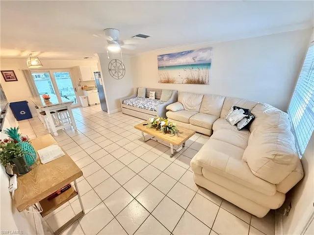 a living room with furniture and a painting