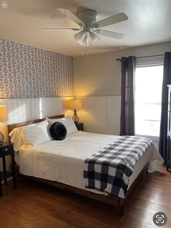 a bedroom with a bed and a dresser