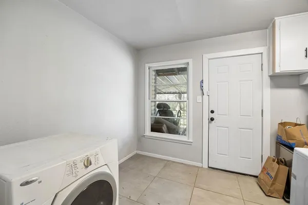 a view of storage and utility room with washer and dryer