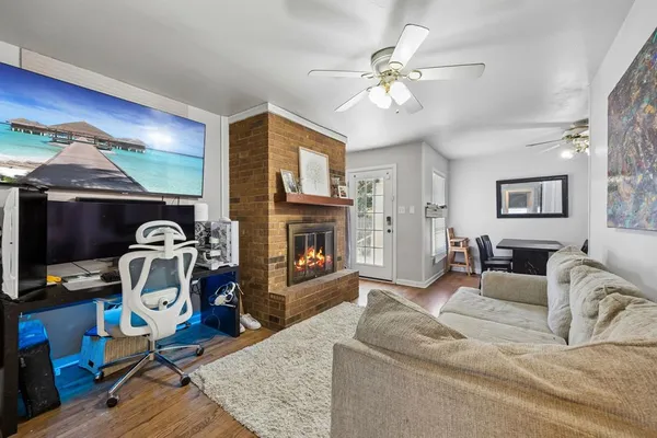 a living room with furniture and a fireplace