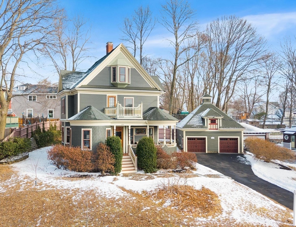 129 High Street Reading, MA 01867 - Photo 1 of 41 a front view of a house with a yard