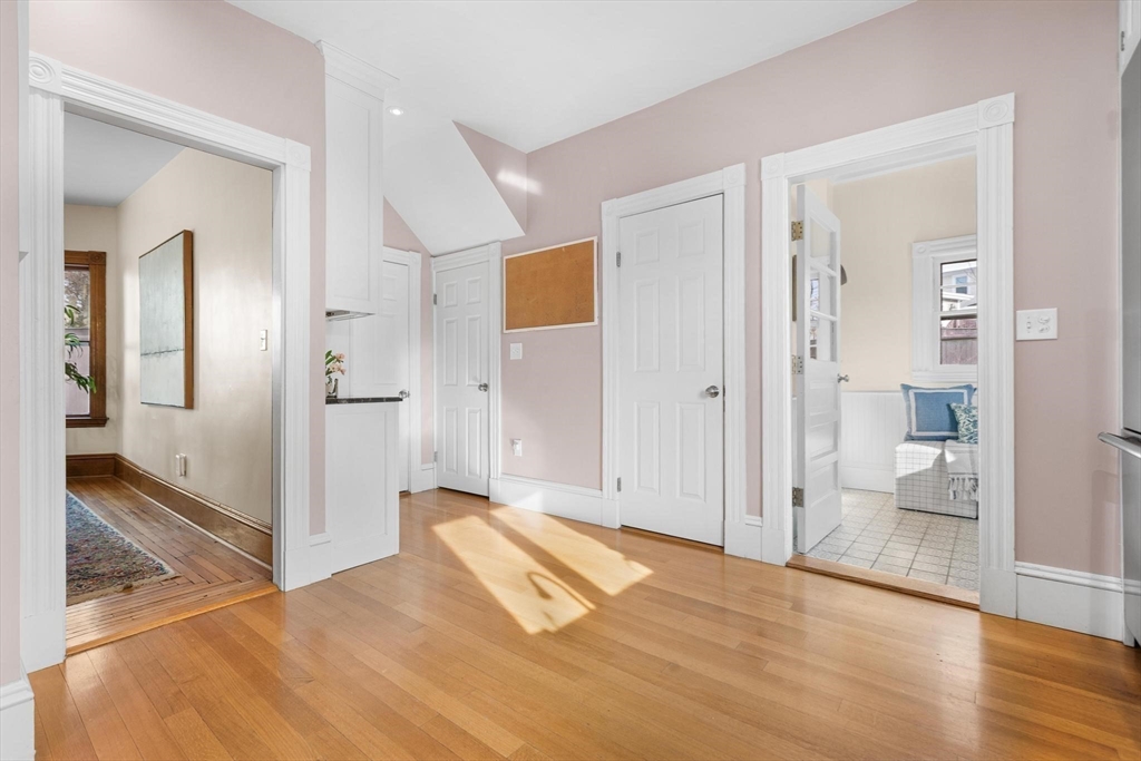 129 High Street Reading, MA 01867 - Photo 14 of 41 wooden floor with room and front door