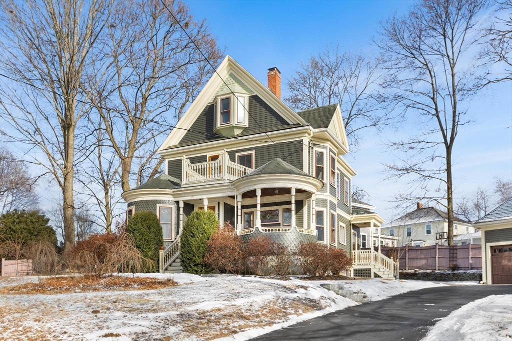 129 High Street Reading, MA 01867 - Photo 2 of 41 a front view of a house with a yard