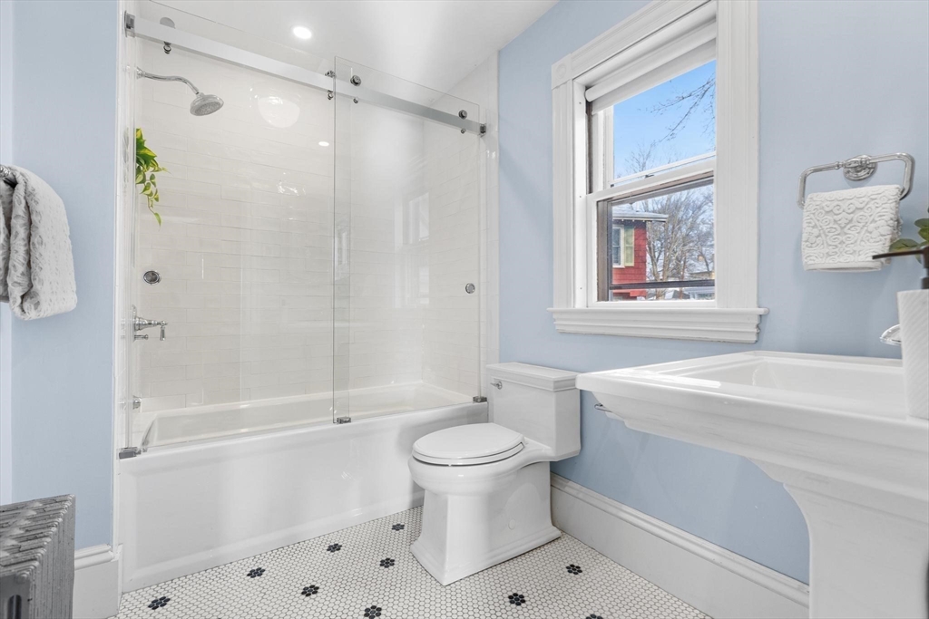 129 High Street Reading, MA 01867 - Photo 22 of 41 a bathroom with a sink a toilet and shower