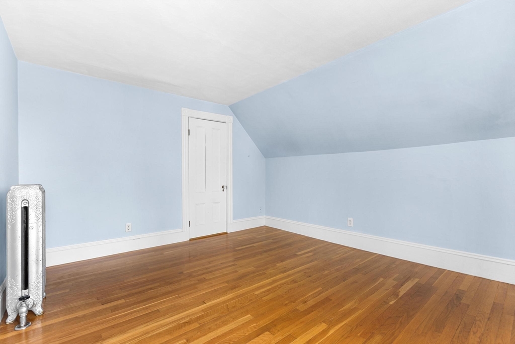 129 High Street Reading, MA 01867 - Photo 24 of 41 a view of empty room with wooden floor