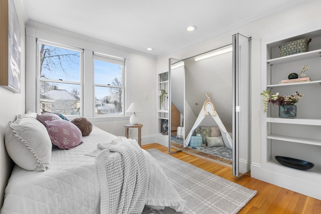 129 High Street Reading, MA 01867 - Photo 25 of 41 a bedroom with a bed and a large window