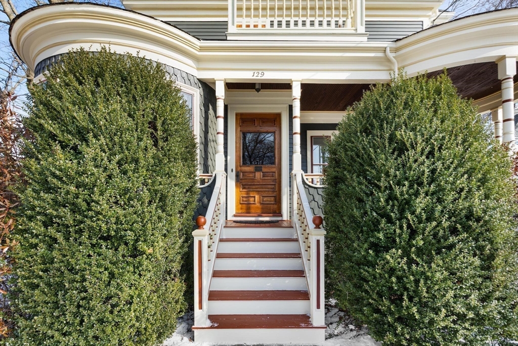129 High Street Reading, MA 01867 - Photo 29 of 41 a front view of a house with a garden