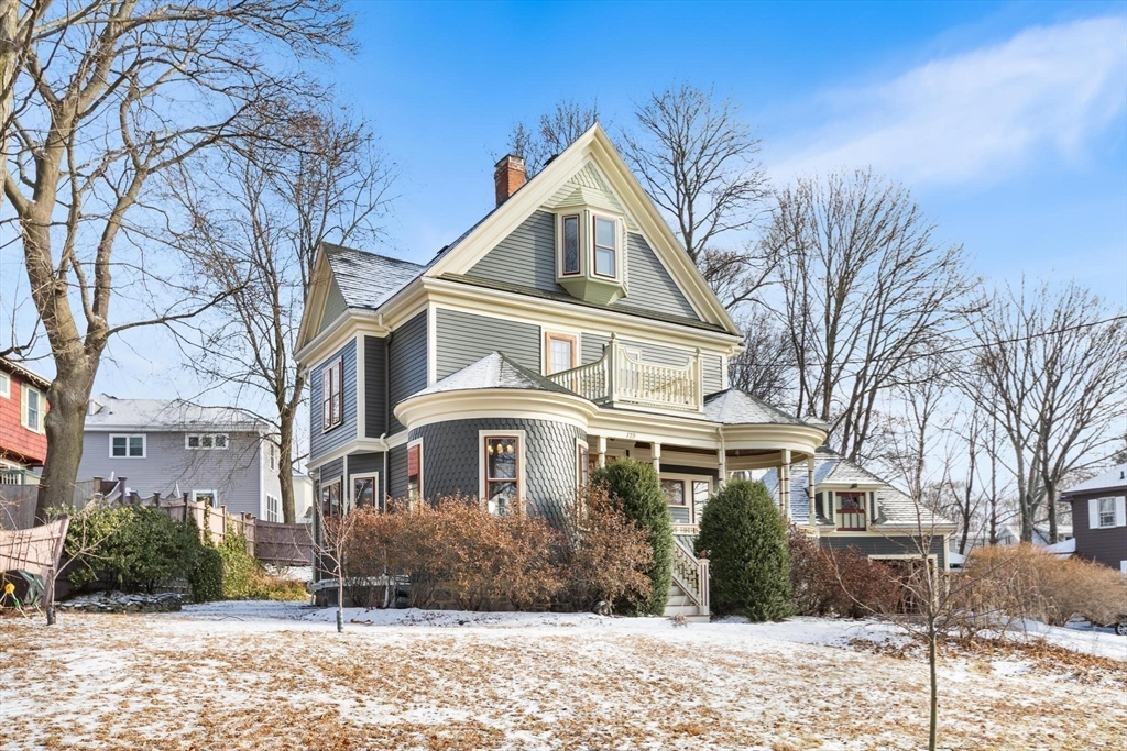 129 High Street Reading, MA 01867 - Photo 30 of 41 a front view of a house with a yard