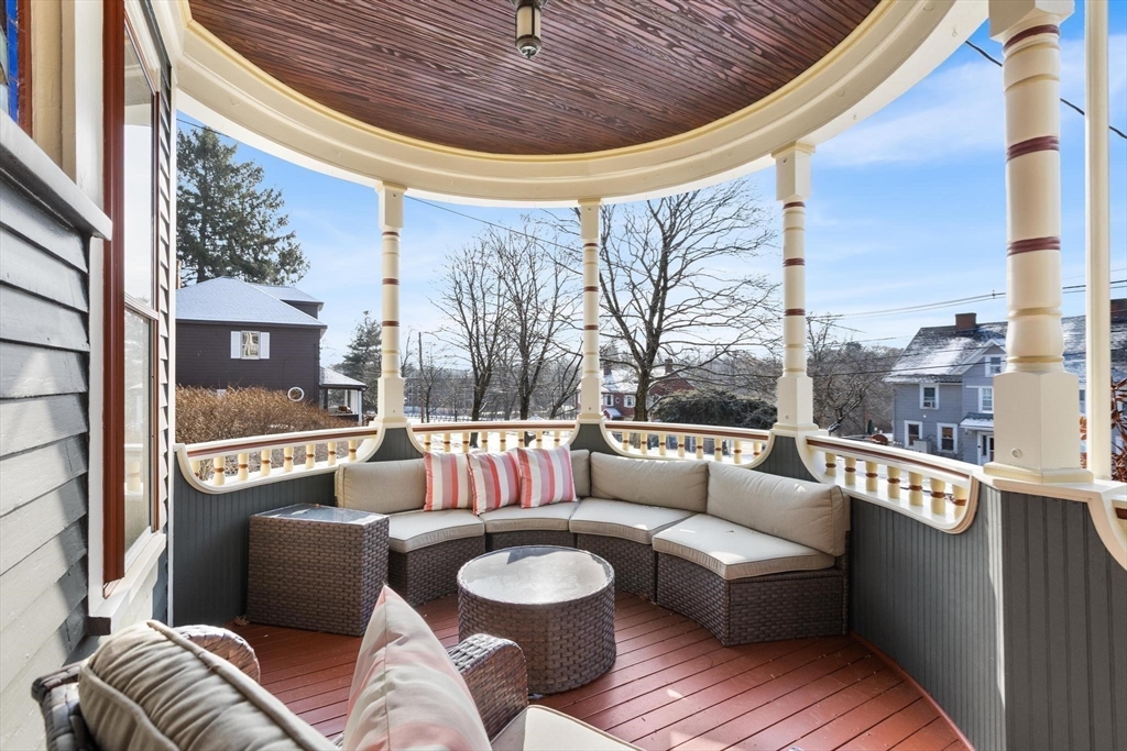 129 High Street Reading, MA 01867 - Photo 3 of 41 a living room with furniture and a floor to ceiling window
